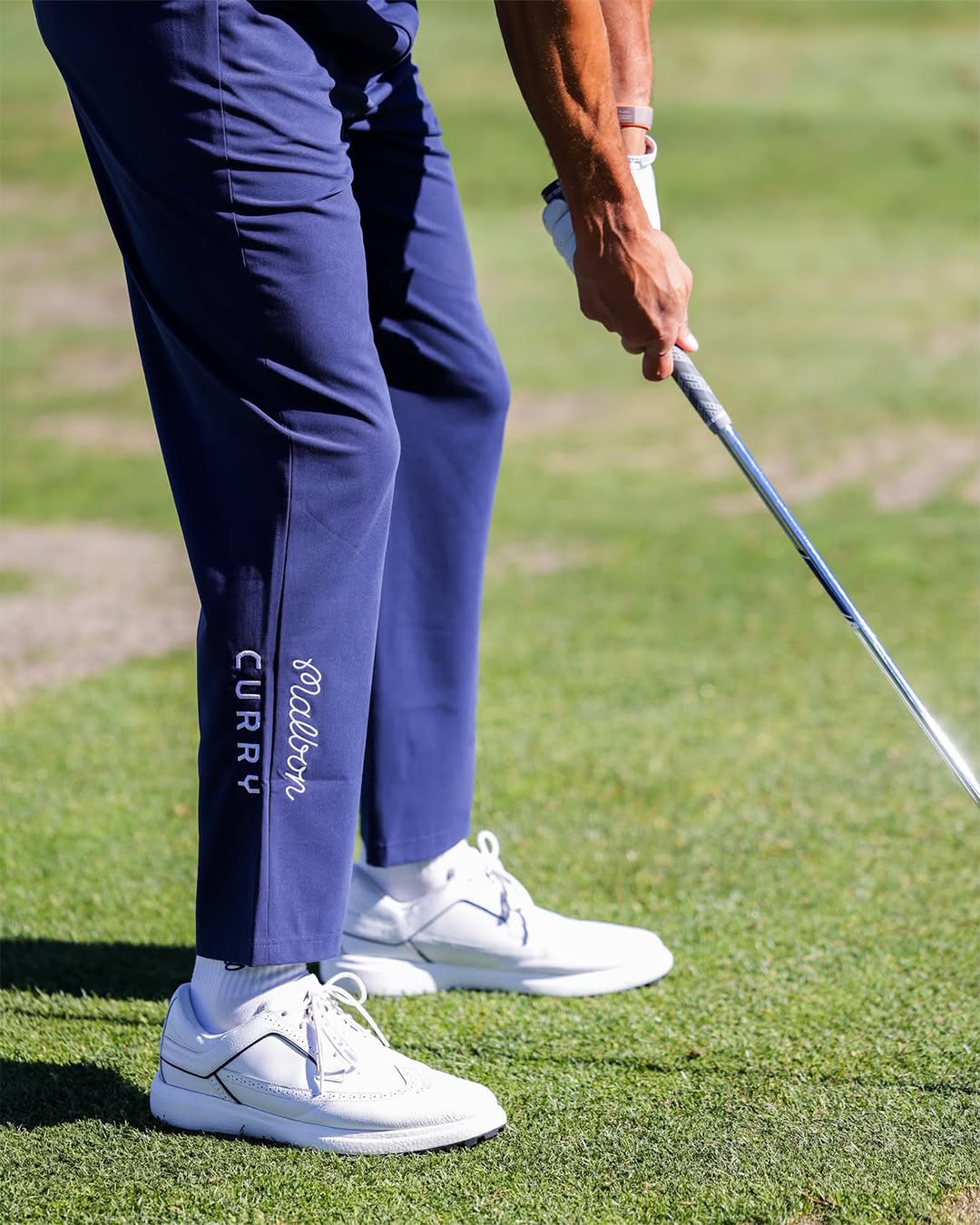 Close up of white leather Curry Brand golf shoe