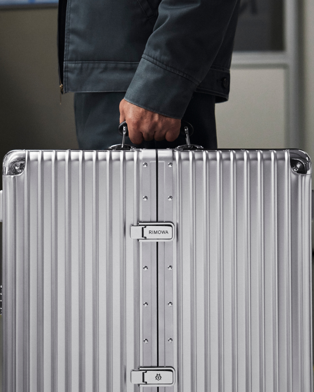 Rimowa grooved aluminum case lifestyle scene