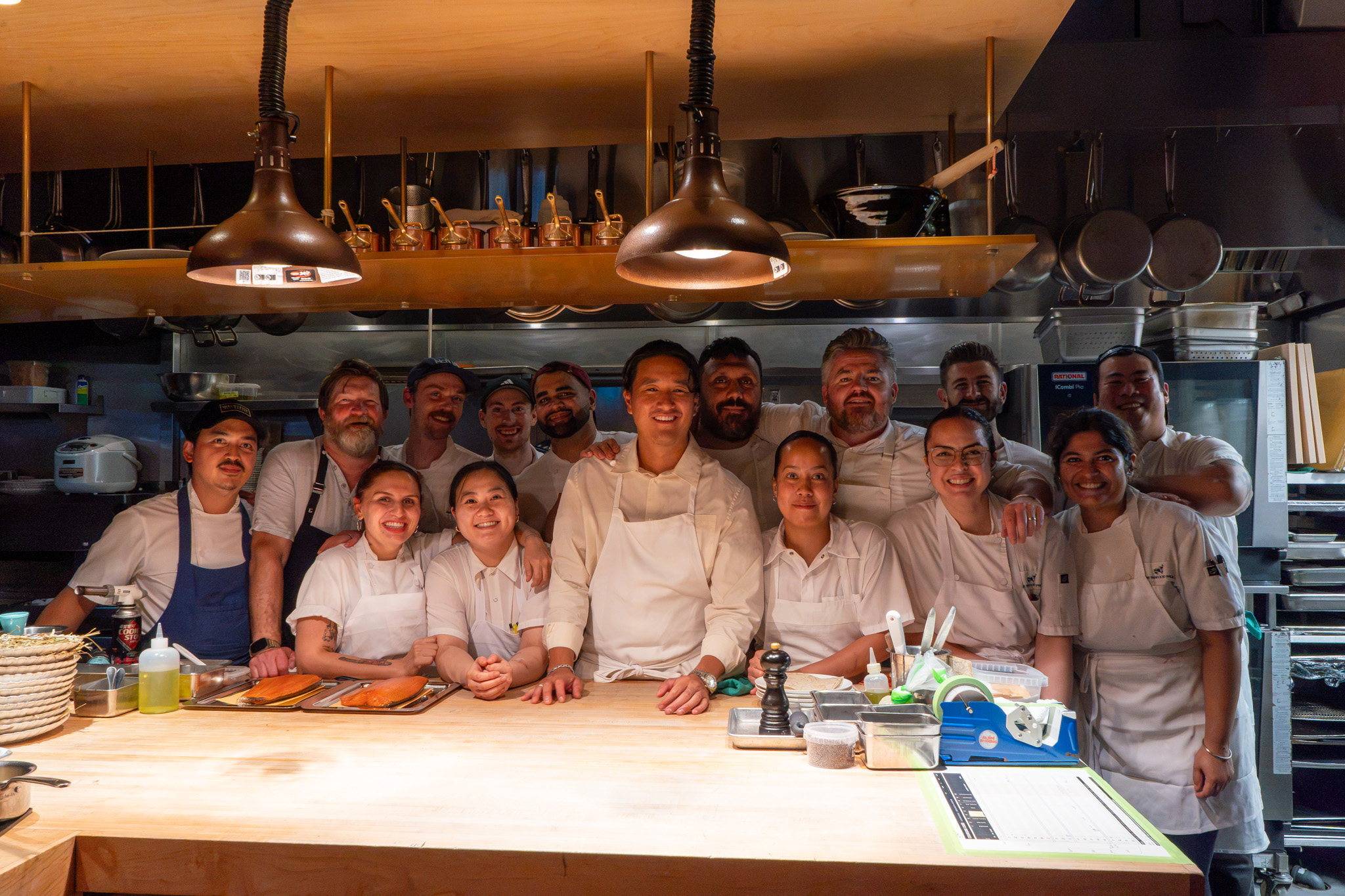 Chefs Jeremy Charles, Kyumin Hahn and Coulson Armstrong cooking together in Toronto