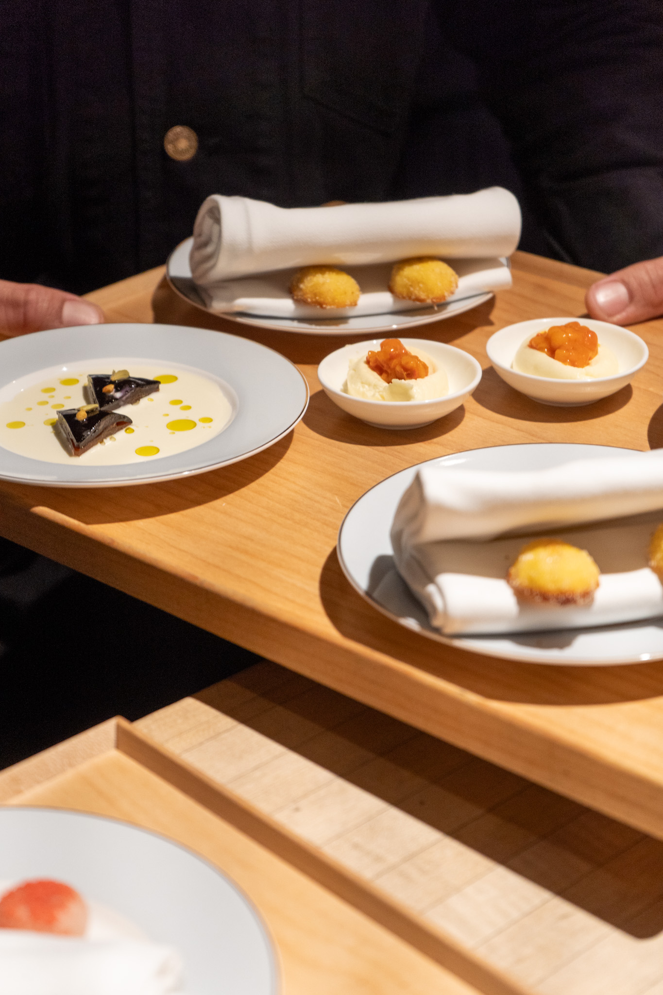 Plated dish featuring fresh seasonal vegetables and preserved ingredients